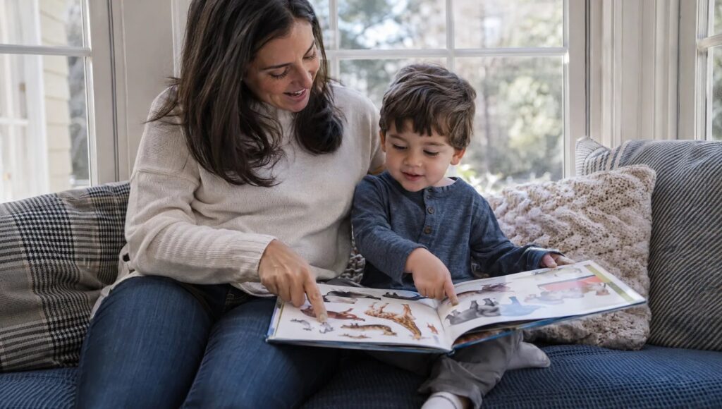 Parent reading a picture book with a toddler instead of screen time to support language development